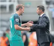  ?? REUTERS ?? Tottenham striker Harry Kane celebrates with manager Mauricio Pochettino after a win.