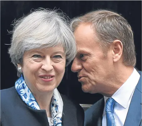  ?? Picture: PA. ?? It was all smiles when Prime Minister Theresa May greeted European Council president Donald Tusk at Downing Street last month but there has been a war of words between them since.