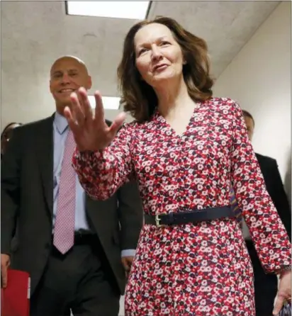  ?? PABLO MARTINEZ MONSIVAIS — THE ASSOCIATED PRESS ?? CIA Director nominee Gina Haspel, waves as she arrives for her meeting with Sen. Joe Manchin, D-W.Va., on Capitol Hill in Washington, Monday. Walking with her is White House legislativ­e affairs director Marc Short, left.