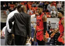  ?? DAVID JABLONSKI / STAFF ?? Dayton coach Anthony Grant consoles Dwayne Cohill after a turnover against Auburn during the Tigers’ 82-72 home win on Saturday.