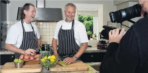  ?? PHOTOS: LINDA ROBERTSON ?? Cooking up a storm . . . Cameraman Michael Belfast puts British celebrity chefs (from left) Paul Rankin and Nick Nairn in the frame during filming of Paul and Nick’s Big Food Trip on the Taieri yesterday.