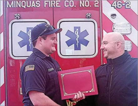  ?? GIL COHEN — DIGITAL FIRST MEDIA ?? Brad Cosgrove, battalion EMS chief, left, and Joseph Colace, paramedic, Minquas Fire Co., display the Clinical Save Award presented by the Chester Council Emergency Medical Service Council to the personnel of Minquas Fire Co. No. 2 ambulance and...