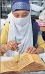  ??  ?? A researcher finding a piece in Hindustan Times’ edition published in 1965 for his work as an SGPC employee helps him; and (right) an employee cleaning a rare manuscript of Gurbani. HT editions have been preserved in Sikh Reference Library since 1955. SAMEER SEHGAL/HT