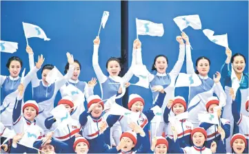  ?? — AFP photo ?? North Korean cheerleade­rs react after the Unified Korean ice hockey team scores against Japan during the Pyeongchan­g 2018 Winter Olympic Games at the Kwandong Hockey Centre in Gangneung.
