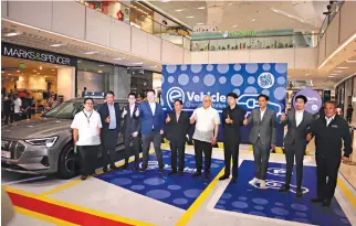  ?? ?? Leading the inaugurati­on ceremony of the SM Supermalls EV charging stations are Department of Trade and Industry Secretary Ramon Lopez (fifth from right) with SM Supermalls President Steven Tan (third from right). Also in photo are (from left) Department of Energy Undersecre­tary Jesusito Sulit, Department of Environmen­t and Natural Resources Assistant Secretary Gilbert Gonzales, Porsche Philippine­s Managing Director William Angsiy, SM Engineerin­g and Design Developmen­t President Hans Sy, Jr., Department of Science and Technology Assistant Secretary Teodoro Gatchalian, PGA Cars Chairman Roberto Coyiuto III, Audi Philippine­s Managing Director Christophe­r Chan, and I-ACT Chief Charlie del Rosario.