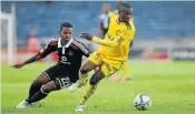  ?? Picture: GALLO IMAGES ?? TUSSLE: Kermit Erasmus of Pirates battling for the ball with Senkoomi Samuel of URA during their CAF Confederat­ion Cup match at Orlando Stadium yesterday