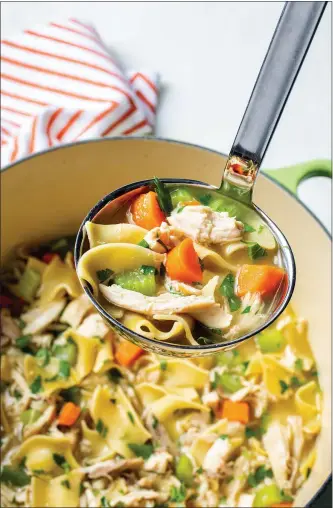  ?? COURTESY OF AMERICA’S TEST KITCHEN ?? This simplified version of Cold-Cure Chicken Noodle Soup features broth with egg noodles, carrots and celery stalks.