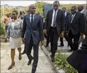  ?? DIEU NALIO CHERY / ASSOCIATED PRESS ?? Haitian President Jovenel Moise and first lady Martine Moise walk hand in hand after a memorial service Friday in Port-au-Prince honoring the victims of the 2010 earthquake.