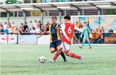  ?? ?? Slough Town in pre-season action against Jack Wilshere’s Arsenal u18s. Photo credit: George Beck