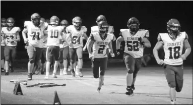  ?? Photo by Alexis Meeks ?? The Bismarck Lions run onto the field during a recent game.