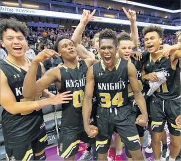  ?? Nick Koza ?? BISHOP MONTGOMERY players celebrate winning the Open Division boys’ basketball state title.