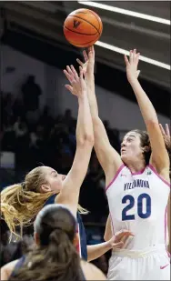  ?? LAURENCE KESTERSON - THE ASSOCIATED PRESS ?? Villanova forward Maddy Siegrist shoots over UConn forward Dorka Juhasz, top left, during the second half Saturday.