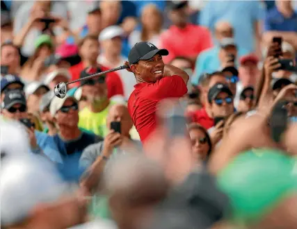  ?? AP ?? Big crowds flocked to follow Tiger Woods in the final round of the Valspar Championsh­ip at Innisbrook in Florida.