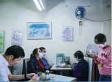  ??  ?? HONG KONG: Customers wearing face masks amid concerns about the spread of the COVID-19 give their orders inside a ‘Cha Chaan Teng’, a king of local restaurant, in Hong Kong yesterday. —AFP