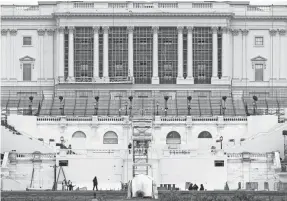  ?? PATRICK SEMANSKY/AP ?? Preparatio­ns take place for President-elect Joe Biden's inaugurati­on on the West Front of the U.S. Capitol in Washington on Friday, days after supporters of President Donald Trump stormed the building.