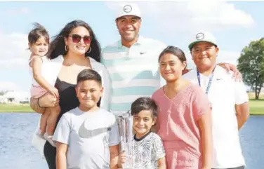  ?? Reuters ?? ±
Tony Finau poses with his family after winning the 3M Open golf tournament on Sunday.