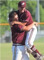  ?? CURT HOGG / NOW NEWS GROUP ?? Brennen Beck and Tommy Howard (right) celebrate Menomonee Falls’ victory over Germantown on Monday night.