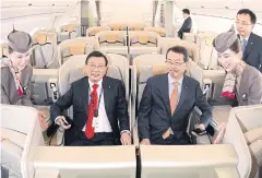  ?? EPA ?? Asiana takes delivery of first A350 Park Sam-koo, chairman of Kumho Asiana Group, second from left, is briefed on Asiana Airlines’ first Airbus A350 jumbo jet during a ceremony marking its delivery at Incheon Internatio­nal Airport, west of Seoul on...