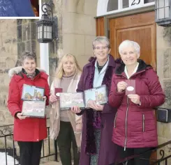  ?? LYNN CURWIN/TRURO NEWS ?? Puzzles and ornaments were created in celebratio­n of the 200th anniversar­y of the Anglican Church in Truro. Holding some of the items are, from left, Judy Mackenzie, Bev DeVouge, Rev. Lori Ramsey and Adele Stokoe.