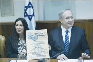  ?? (Yonatan Sindel, pool/Flash90) ?? PRIME MINISTER Benjamin Netanyahu and Culture Minister Miri Regev discuss the coin, minted during the Great Revolt against the Romans, at yesterday’s weekly cabinet meeting.