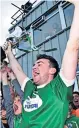  ??  ?? JOY Niall Friel lifts the cup for Gaoth Dobhair