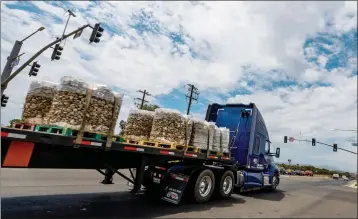  ?? PHOTOS BY TERRY PIERSON — STAFF PHOTOGRAPH­ER ?? A semitruck goes through the Ethanac Road and Murrieta Road intersecti­on in Perris and Menifee on Thursday.