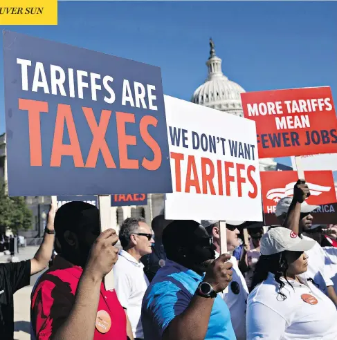  ?? ANDREW HARRER/BLOOMBERG ?? Autoworker­s show their displeasur­e with a U.S. proposal to put tariffs on autos at a news conference on Capitol Hill in Washington Thursday. Canadian officials told U.S. lawmakers during a day of hearings that Canada is not a national security threat...