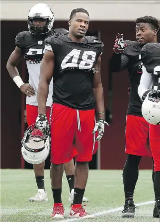  ?? JULIE OLIVER ?? Kevin Pierre-Louis, centre, is trying to earn a Redblacks roster spot as a linebacker after playing safety at Colorado State University. “I’m blessed for the opportunit­y,” Pierre-Louis says.