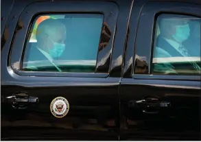  ?? (The New York Times/Doug Mills) ?? Vice President Mike Pence (left) arrives Wednesday at the White House wearing a mask. Pence has been keeping his distance from President Donald Trump since last week when Pence’s spokeswoma­n tested positive for the coronaviru­s.