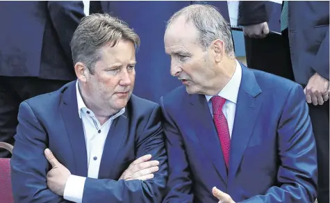  ?? PHOTO: MAXWELLS ?? Talking shop: Housing Minister Darragh O’Brien and Taoiseach Micheál Martin, pictured in Malahide in 2018.