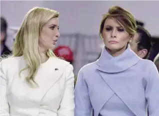  ??  ?? WASHINGTON: This file photo taken on January 20, 2017 shows US First Lady Melania Trump speaking with Ivanka Trump during the presidenti­al inaugural parade for US President Donald Trump. —AFP