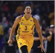  ?? MARK J. TERRILL — THE ASSOCIATED PRESS FILE ?? Los Angeles Sparks forward Candace Parker celebrates during the second half in Game 3 of the WNBA finals on Sept. 29, 2017, in Los Angeles. The three-time WNBA champion has announced she's retiring. Parker, a two-time league MVP, announced in a social media post that she's ending her career after 16 seasons.