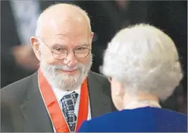  ?? Lewis Whyld
Associated Press ?? A NATIONAL HONOR Oliver Sacks is honored with the title Commander of the Order of the British Empire by Queen Elizabeth II in 2008. Sacks retained his British citizenshi­p.