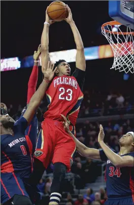  ?? The Detroit Free Press / TNS ?? The New Orleans Pelicans’ Anthony Davis muscles to the hoop during the fourth quarter against the Detroit Pistons on Feb. 21, 2016, at the Palace of Auburn Hills in Auburn Hills, Mich.