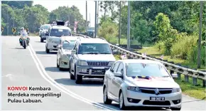  ??  ?? KONVOI Kembara Merdeka mengelilin­gi Pulau Labuan.