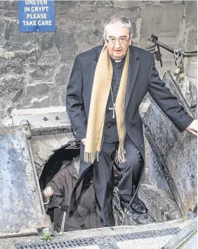  ?? PHOTO: COLIN O’RIORDAN ?? Visit: The Archbishop of Dublin, Diarmuid Martin, emerges from the crypt of St Michan’s.