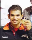  ??  ?? In this Oct 9, 2010 file photo, Indian wrestler Narsingh Yadav displays his medal after winning against South Africa Richard Brian Addinall in the 74 kg category wrestling at the Commonweal­th Games in New Delhi,
India. (AP)