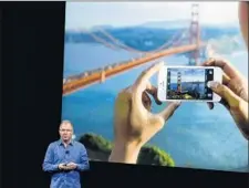  ?? Marcio Jose Sanchez Associated Press ?? APPLE EXECUTIVE Greg Joswiak unveils the new iPhone SE at the tech company’s Cupertino, Calif., headquarte­rs in March.