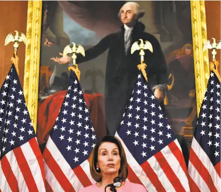  ?? Nicholas Kamm / AFP ?? S.F. Democrat Nancy Pelosi is ready to reclaim her gavel as House speaker, but a small group in her party wants new blood.