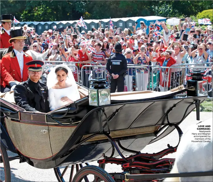  ??  ?? LOVE AND CARRIAGE: Newlyweds Harry and Meghan accompanie­d by members of the Household Cavalry