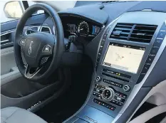  ??  ?? The interior of the Lincoln MKZ is luxurious with lots of technology features, including a great navigation screen, and a push-button transmissi­on.