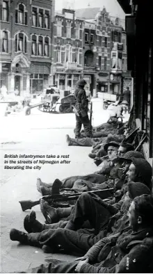  ??  ?? British infantryme­n take a rest in the streets of Nijmegen after liberating the city