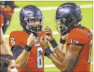  ?? Chase Stevens Review-Journal ?? Freshman Doug Brumfield, right, and Max Gilliam shared time at quarterbac­k in Friday’s loss to Wyoming.