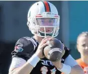  ?? AL DIAZ/MIAMI HERALD ?? Quarterbac­k Jack Allison has had more range of motion in his shoulder over the last couple of days since he bruised it in Saturday’s scrimmage.