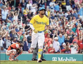  ?? Winslow Townson / Getty Images ?? The Red Sox’s Xander Bogaerts starts toward the bases after his three-run home run against the Baltimore Orioles during the sixth inning at Fenway Park on Saturday.