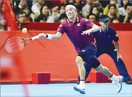  ?? (AFP) ?? Japan’s Kei Nishikori returns a shot against France’s Richard Gasquet during their men’s singles semifinal at the Japan Open tennis championsh­ips inTokyo on Oct 6.