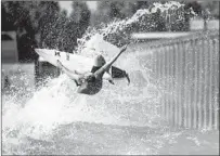  ??  ?? JOHN JOHN FLORENCE of Hawaii, a 2017 WSL champion, does an aerial over the machine-groomed wave in practice.