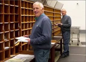  ??  ?? Postmen John Whelan and Paul Cashin at the New Ross An Post depot.