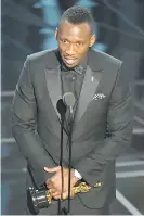  ?? MARK RALSTON / AFP / GETTY IMAGES ?? Mahershala Ali delivers a speech after winning the award for Best Supporting Actor for his role in Moonlight.