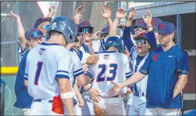  ?? L.E. Baskow
Las Vegas Review-journal @Left_eye_images ?? Coronado players celebrate another run during the Cougars’ 11-9 win Thursday.